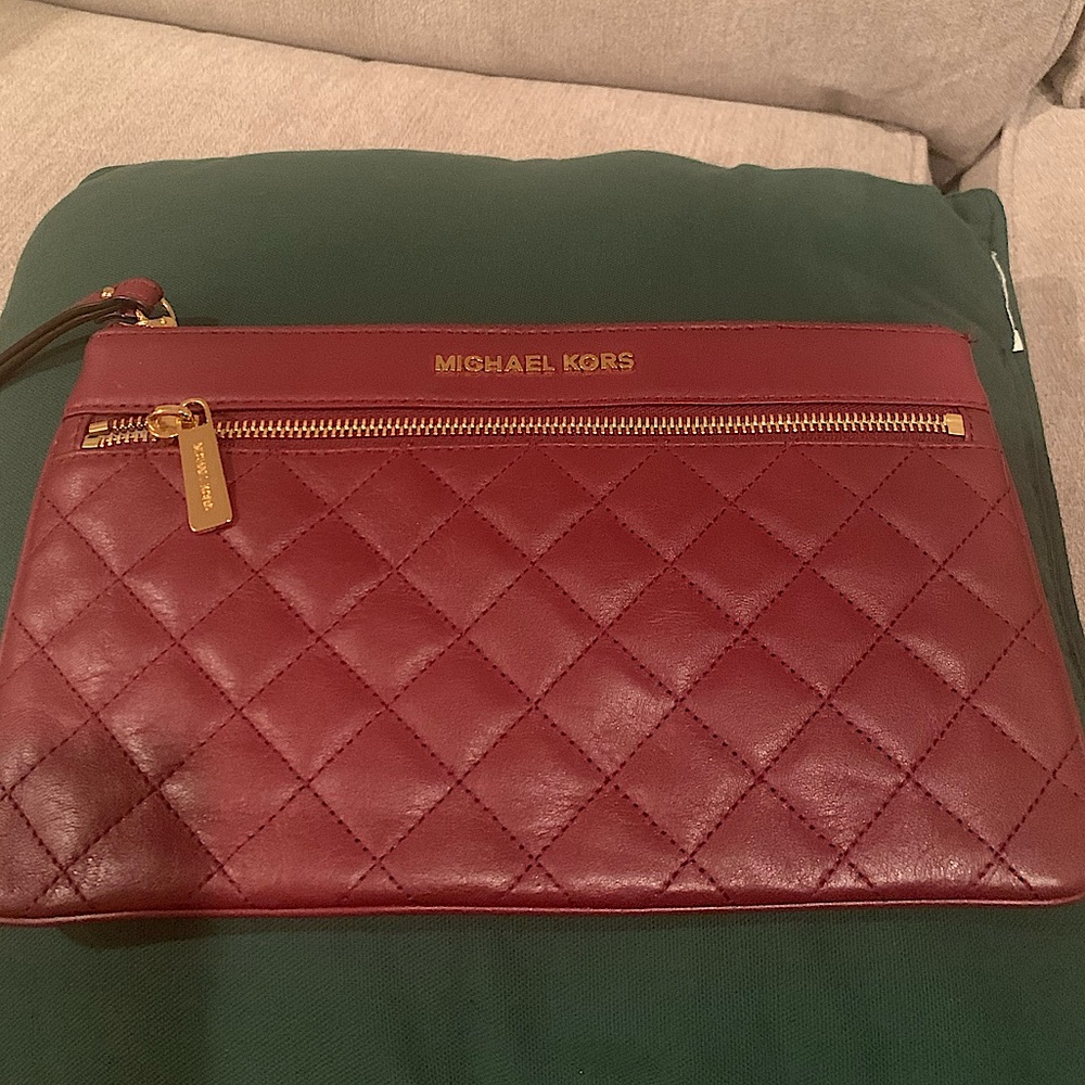 Maroon Michael Kors clutch wristlet